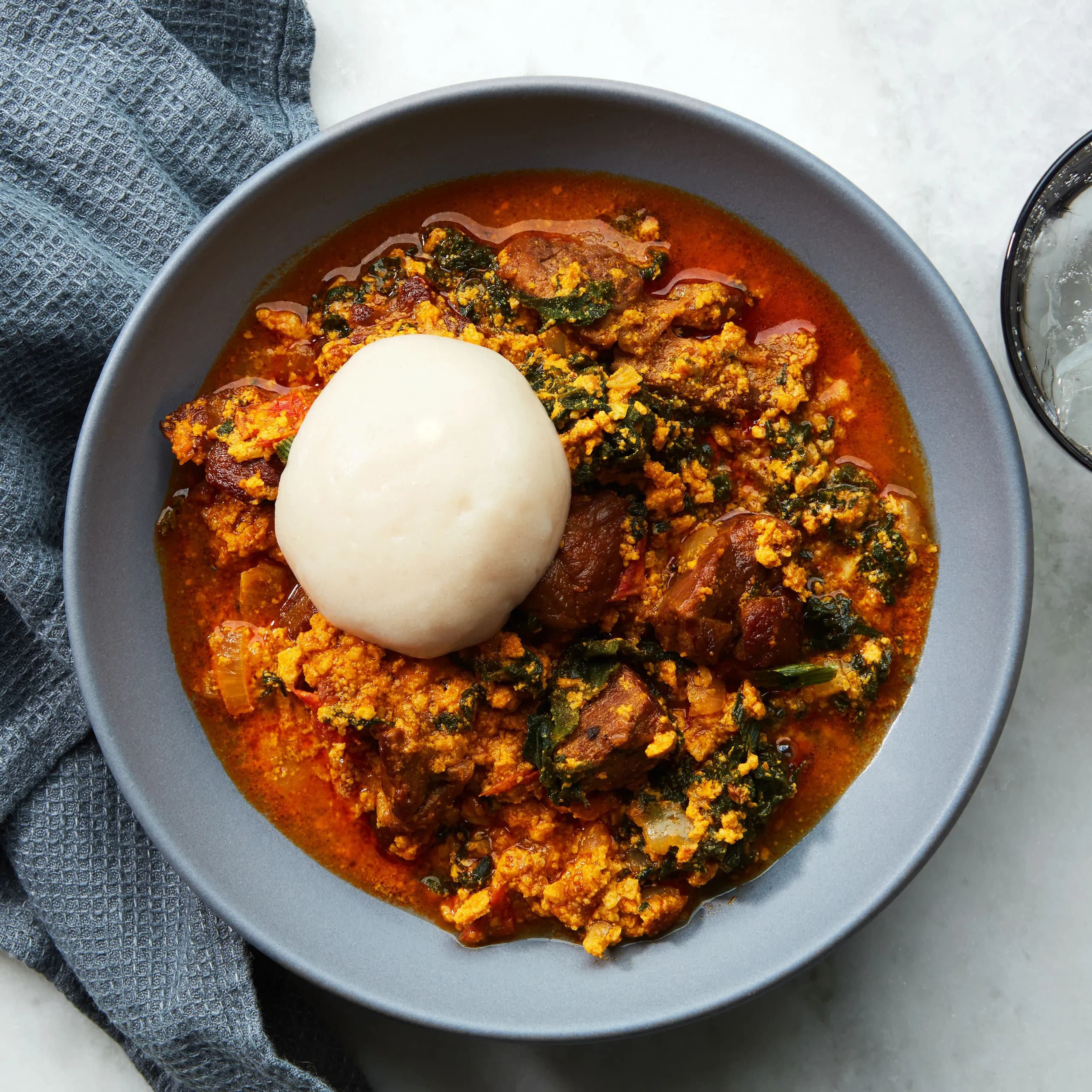 Egusi Soup image showing Afro-fusion catering presentation